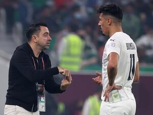 صورة أرشيفية لتشافي (يسار) وبغداد بونجاح