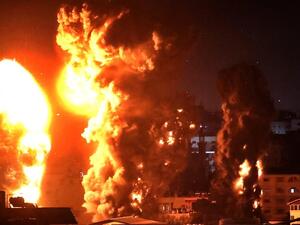 Fire and smoke rise above buildings in Gaza City from Israeli warplanes