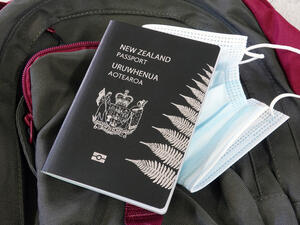 New Zealand unveils plan to re-open borders starting early January