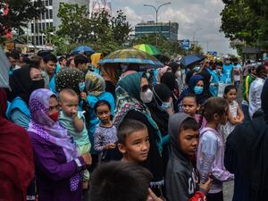 Desperate Afghan mother forced to giving up her daughter to pay off debt