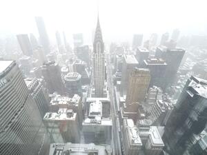 A view of the Chrysler Building (C) from The Summit at One Vanderbilt Observation Deck, during a snow storm in New York City on January 29, 2022. (Photo by TIMOTHY A. CLARY / AFP) winter storm tears through US East Coast
