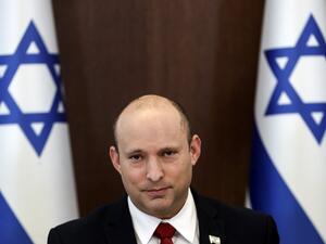 Israeli Prime Minister Naftali Bennett poses for a picture during the weekly cabinet meeting in Jerusalem on July 11, 2021. (Photo by RONEN ZVULUN / POOL / AFP) Israeli Prime Minister Naftali Bennett