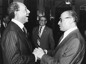 Anwar Sadat (L), Menachem Begin 