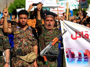 Members of the Yemeni security forces affiliated with the Huthi rebels take to the streets of Sanaa on March 7, 2022 during a demonstration against the economic blockade imposed by the United States and Saudi Arabia on Yemen. (Photo by MOHAMMED HUWAIS / AFP) Houthi rebels target oil company Aramco facility in Saudi Arabia
