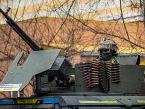 A Ukrainian soldier sits in an armored car in the suburbs of Kyiv, on March 26, 2022, during Russia's military invasion launched on Ukraine. (Photo by FADEL SENNA / AFP) Joe Biden and other NATO leaders previously ruled out the possibility of the Western alliance's direct involvement in the conflict.