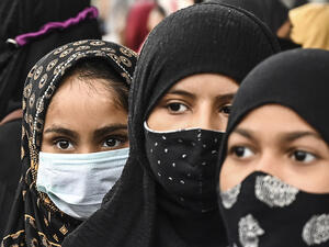 Muslim women take part in a protest against the recent hijab ban 