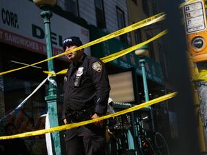 Police gather at the scene of a shooting at the 36 St subway station on April 12, 2022 in the Brooklyn borough of New York City.