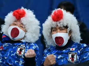 Japanese supporters pose before the start of the FIFA World Cup Qatar 2022 Asian zone qualification football match between Japan and Saudi Arabia at Saitama Stadium in Saitama on February 1, 2022. (Photo by Philip FONG / AFP)