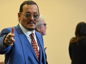 The woman then held up the baby and claimed Depp was the father