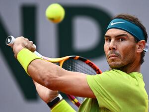 Spain's Rafael Nadal returns the ball to Netherland's Botic Van De Zandschulp during their men's singles match on day six of the Roland-Garros Open tennis tournament at the Court Suzanne-Lenglen in Paris on May 27, 2022. (Photo by Anne-Christine POUJOULAT / AFP)