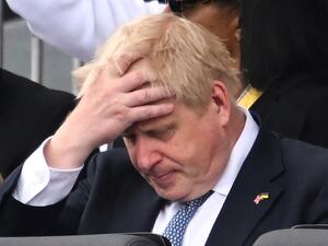 Britain's Prime Minister Boris Johnson reacts during the Platinum Pageant in London on June 5, 2022 as part of Queen Elizabeth II's platinum jubilee celebrations. (Photo by Leon Neal / POOL / AFP) Britain's Prime Minister Boris Johnson