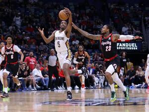 Herbert Jones #5 of the New Orleans Pelicans steals the ball from Ben McLemore #23 of the Portland Trail Blazers during the first half at the Smoothie King Center on April 07, 2022 in New Orleans, Louisiana.  (Photo by Jonathan Bachman / GETTY IMAGES NORTH AMERICA / Getty Images via AFP)