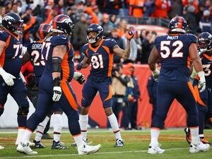 Melvin Gordon #25 of the Denver Broncos celebrates with Tim Patrick #81 following his touchdown run during the third quarter against the Kansas City Chiefs of the Denver Broncos at Empower Field At Mile High on January 08, 2022 in Denver, Colorado. Jamie Schwaberow/Getty Images/AFP (Photo by Jamie Schwaberow / GETTY IMAGES NORTH AMERICA / Getty Images via AFP)