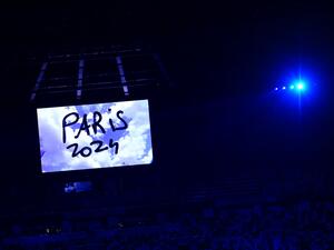 A video announcing the Paris 2024 Olympics Game is seen during the closing ceremony of the Tokyo 2020 Olympic Games, at the Olympic Stadium, in Tokyo, on August 8, 2021. (Photo by Pedro PARDO / AFP)
