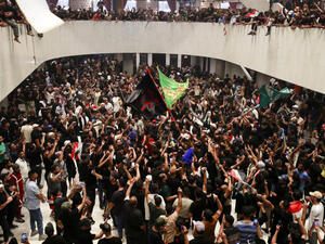 Supporters of cleric Moqtada Sadr cheer after entering Iraq's parliament