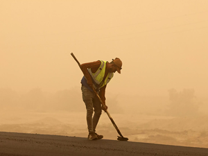 A worker in the sandstorm 