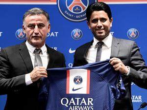 French coach Christophe Galtier (L) and PSG's President Nasser Al-Khelaifi (R) holds a jersey as they pose at the end of a press conference after Galtier was appointed as French L1 football club Paris Saint-Germain's (PSG) head coach, at the Parc des Princes stadium in Paris on July 5, 2022. (Photo by BERTRAND GUAY / AFP)