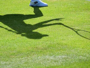 The shadow of Belgium's Elise Mertens is pictured as she returns the ball to Colombia's Camila Osorio during their women's singles tennis match on the first day of the 2022 Wimbledon Championships at The All England Tennis Club in Wimbledon, southwest London, on June 27, 2022. (Photo by SEBASTIEN BOZON / AFP)