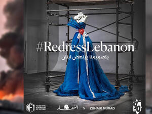 Zuhair Murad’s designed dress (Instagram/@zuhairmuradofficial/@annaharnews)/ Background photo shows a helicopter puts out a fire at the scene of an explosion at the port of Lebanon's capital Beirut. (AFP/File) Zuhair Murad