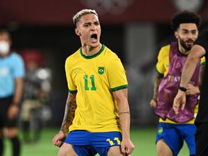 Brazil's Antony celebrates after teammate Malcom Filipe scored against Spain during the Tokyo 2020 Olympic Games football competition men's gold medal match at Yokohama International Stadium in Yokohama, Japan, on August 7, 2021. (Photo by Anne-Christine POUJOULAT / AFP)