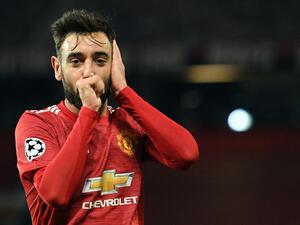Manchester United's Portuguese midfielder Bruno Fernandes celebrates scoring the second goal during the UEFA Champions league group H football match between Manchester United and Istanbul Basaksehir at Old Trafford stadium in Manchester, north west England, on November 24, 2020. / AFP / Oli SCARFF