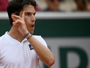 Austria's Dominic Thiem reacts during his men's singles match against Bolivia's Hugo Dellien at the Court Simonne-Mathieu on day one of the Roland-Garros Open tennis tournament in Paris on May 22, 2022. (Photo by Christophe ARCHAMBAULT / AFP)