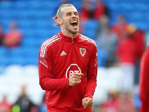 Wales' midfielder Gareth Bale smiles as he warms up ahead of the UEFA Nations League, league A group 4 football match between Wales and Netherlands at Cardiff City stadium in Cardiff, south Wales on June 8, 2022. (Photo by Geoff Caddick / AFP)