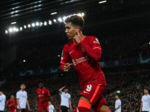  Liverpool's Brazilian midfielder Roberto Firmino celebrates after scoring his team third goal during the UEFA Champions League quarter final second leg football match between Liverpool and Benfica at the Anfield stadium, in Liverpool, on April 13, 2022. (Photo by Paul ELLIS / AFP)