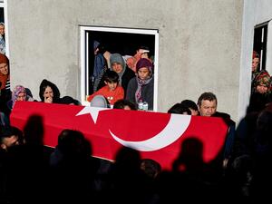 Mourners react during the funeral ceremony for Ridvan Acet, one of the miners who died after an explosion in a coal mine in Amasra, in Turkey's Bartin Province, on October 15, 2022. (Photo by Yasin AKGUL / AFP) coal mine