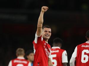 Arsenal's Swiss midfielder Granit Xhaka celebrates after scoring the opening goal of the UEFA Europa League Group A football match between Arsenal and PSV Eindhoven at The Arsenal Stadium in London, on October 20, 2022. (Photo by ADRIAN DENNIS / AFP)