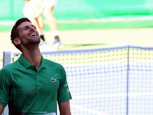Serbian tennis player Novak Djokovic reacts during an exhibition match, organised to mark the opening of a tennis court at the "Archaeological park of the Bosnian pyramid" near Visoko, north of Sarajevo, on July 13, 2022. (Photo by ELVIS BARUKCIC / AFP)