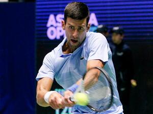 Serbia's Novak Djokovic returns a ball to Daniil Medvedev of Russia during their men's singles semi-final match at the Astana Open tennis tournament in Astana on October 8, 2022. (Photo by AFP)