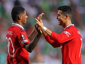 (R to L) Manchester United's Portuguese striker Cristiano Ronaldo and Manchester United's English striker Marcus Rashford celebrate together after the latter's goal during the UEFA Europa League group E football match between Cyprus' Omonia Nicosia and England's Manchester United at GSP stadium in the capital Nicosia on October 6, 2022. (Photo by AFP)