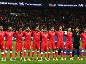 Tunisia's players listen to the national anthems prior to the friendly football match between Brazil and Tunisia at the Parc des Princes in Paris on September 27, 2022. (Photo by FRANCK FIFE  AFP)