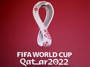 The logo of the Qatar 2022 FIFA World Cup football tournament is displayed on a wall in Doha on October 23, 2022. (Photo by Gabriel BOUYS / AFP)