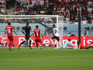 England's forward #11 Marcus Rashford (C) scores his team's fifth goal during the Qatar 2022 World Cup Group B football match between England and Iran at the Khalifa International Stadium in Doha on November 21, 2022. (Photo by Adrian DENNIS / AFP)