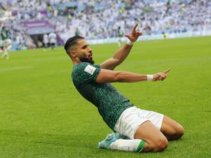 Saudi Arabia's forward #11 Saleh Al-Shehri celebrates after scoring his team's first goal during the Qatar 2022 World Cup Group C football match between Argentina and Saudi Arabia at the Lusail Stadium in Lusail, north of Doha on November 22, 2022. (Photo by Odd ANDERSEN / AFP)