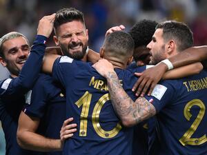 France's forward #09 Olivier Giroud (2ndL) celebrates with teammates after he scored during the Qatar 2022 World Cup Group D football match between France and Australia at the Al-Janoub Stadium in Al-Wakrah, south of Doha on November 22, 2022. (Photo by FRANCK FIFE / AFP)