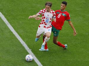 Morocco's midfielder #08 Azzedine Ounahi (R) fights for the ball with Croatia's midfielder #10 Luka Modric (L) during the Qatar 2022 World Cup Group F football match between Morocco and Croatia at the Al-Bayt Stadium in Al Khor, north of Doha on November 23, 2022. (Photo by Odd ANDERSEN / AFP)