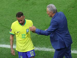 Brazil's coach #00 Tite greets Brazil's forward #10 Neymar as he is replaced during the Qatar 2022 World Cup Group G football match between Brazil and Serbia at the Lusail Stadium in Lusail, north of Doha on November 24, 2022. (Photo by Giuseppe CACACE / AFP)