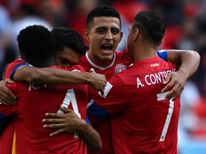 Costa Rica's players celebrate after winning the Qatar 2022 World Cup Group E football match between Japan and Costa Rica at the Ahmad Bin Ali Stadium in Al-Rayyan, west of Doha on November 27, 2022. (Photo by Philip FONG / AFP)