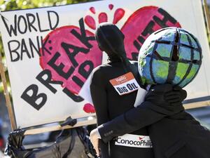 Climate activists rally against the use of fossil fuels outside of the World Bank Headquarters on October 14, 2022 in Washington, DC. Kevin Dietsch/Getty Images/AFP Climate activists