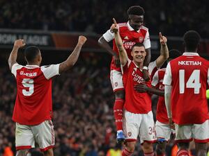 Arsenal's Swiss midfielder Granit Xhaka (C) celebrates with teammates after scoring the opening goal of the UEFA Europa League Group A football match between Arsenal and PSV Eindhoven at The Arsenal Stadium in London, on October 20, 2022. (Photo by ADRIAN DENNIS / AFP)