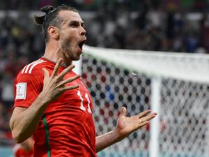Wales' forward #11 Gareth Bale celebrates scoring his team's first goal during the Qatar 2022 World Cup Group B football match between USA and Wales at the Ahmad Bin Ali Stadium in Al-Rayyan, west of Doha on November 21, 2022. (Photo by NICOLAS TUCAT / AFP)