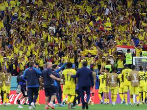 Ecuador players celebrate with their supporters after they won the Qatar 2022 World Cup Group A football match against Qatar at the Al-Bayt Stadium in Al Khor, north of Doha on November 20, 2022. (Photo by KARIM JAAFAR / AFP)