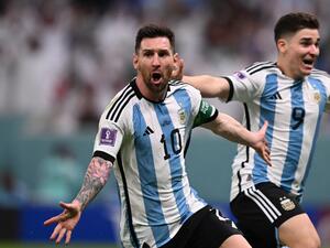 Lionel Messi helped keep Argentina's World Cup bid alive with the first goal in a 2-0 victory over Mexico on Saturday.