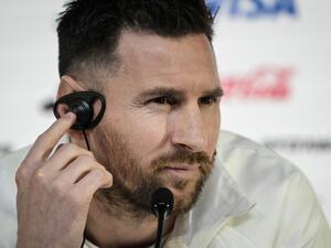 Argentina's forward Lionel Messi reacts as he gives a press conference at the Qatar National Convention Center (QNCC) in Doha, on November 21, 2022, on the eve of the Qatar 2022 World Cup football match between Argentina and Saudi Arabia. (Photo by JUAN MABROMATA / AFP)