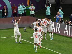 Morocco's midfielder #11 Abdelhamid Sabiri (back) celebrates teammates after he scored his team's first goal during the Qatar 2022 World Cup Group F football match between Belgium and Morocco at the Al-Thumama Stadium in Doha on November 27, 2022. (Photo by Glyn KIRK / AFP)