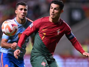 Portugal's forward Cristiano Ronaldo vies with Spain's midfielder Rodrigo Hernandez (L) during the UEFA Nations League, league A, group 2 football match between Portugal and Spain, at the Municipal Stadium in Braga on September 27, 2022. (Photo by PATRICIA DE MELO MOREIRA / AFP)