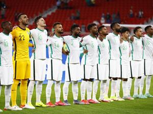 Saudi Arabia's players sing their national anthem ahead of during the FIFA Arab Cup 2021 group C football match between Morocco and Saudi Arabia at the Al-Thumama Stadium in the capital city of Doha on December 7, 2021. (Photo by Khaled DESOUKI / AFP)
